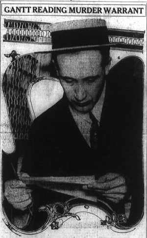 Gantt reading murder warrant [John M. Gantt was a family friend of Mary Phagan's and was accused of being "infatuated" with the young girl. He was let into the factory on Saturday to retrieve pairs of shoes he had left there prior to his leaving the company. Newt Lee accompanied him as he retrieved his shoes and left Saturday afternoon -- Ed.]